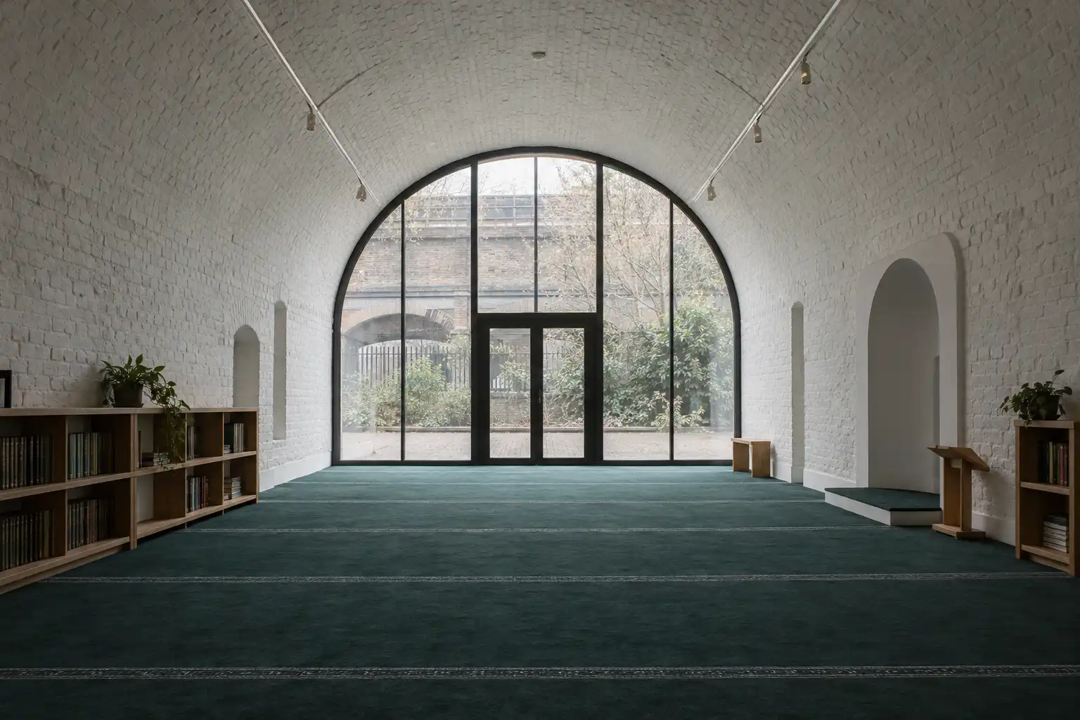 Interior of a converted railway arch used as a prayer hall, illustrative visualisation